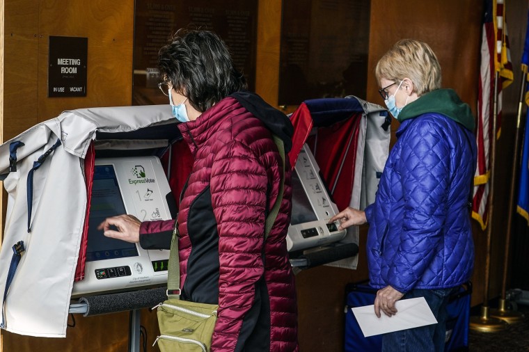 Image: Residents cast their votes at the Warner Park Community Recreation Center on the first day of early voting on March 21, 2023, in Madison, Wis. 