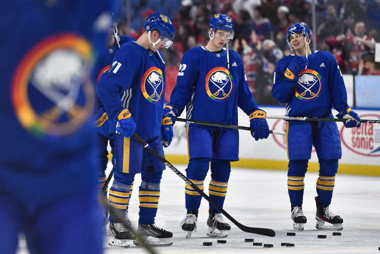 Buffalo Sabres Victor Olofsson, left, Jack Quinn and JJ Peterka wear special warmup jerseys commemorating Pride Night before a game against the Montreal Canadiens in Buffalo, N.Y.