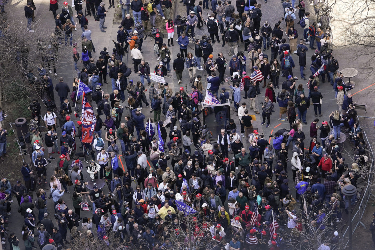 Demonstrators gather outside New York Supreme Court where former President Donald Trump is expected to appear, Tuesday, April 4, 2023, in New York.