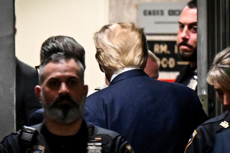 Image: Former President Donald Trump leaves his hearing at the Manhattan Criminal Court in New York on April 4, 2023.