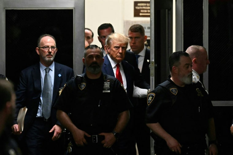 Donald Trump makes his way inside the Manhattan Criminal Courthouse in New York on April 4, 2023.