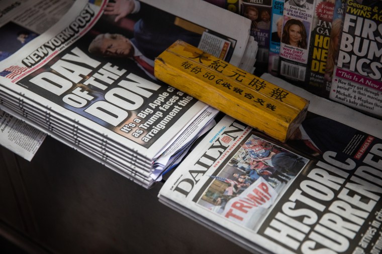 Newspapers highlighting former President Donald Trump's arrest and arraignment are among the offerings at Abul Kalam Azad's newstand near New York Criminal Court on April 4, 2023.