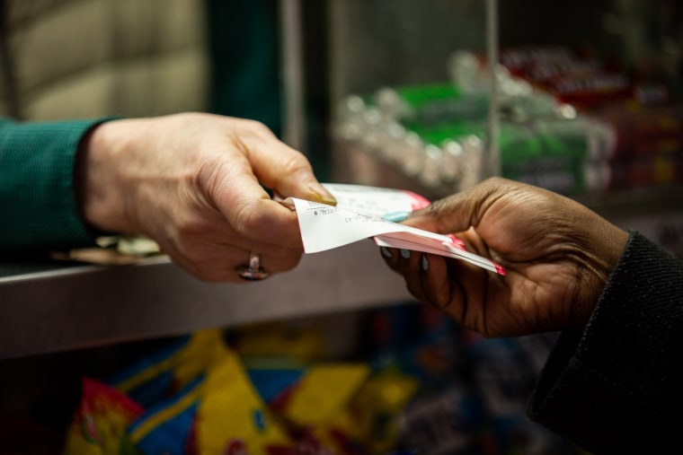 Abul Kalam Azad says "Good luck" to every customer who buys a lotto ticket from his newsstand.