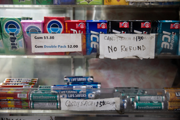 Prices and a notice about the refund policy adorn Abul Kalam Azad's newsstand near New York Criminal Court on April 4, 2023.