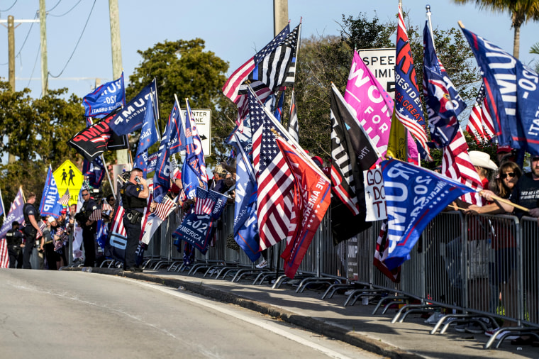 Image: Supporters of former President Donald Trump chant and wave flags during a rally to welcome him home on April 4, 2023, in West Palm Beach, Fla.