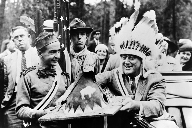 President Franklin Delano Roosevelt receives a miniature wigwam at a Boy Scout camp in New York State in 1933.