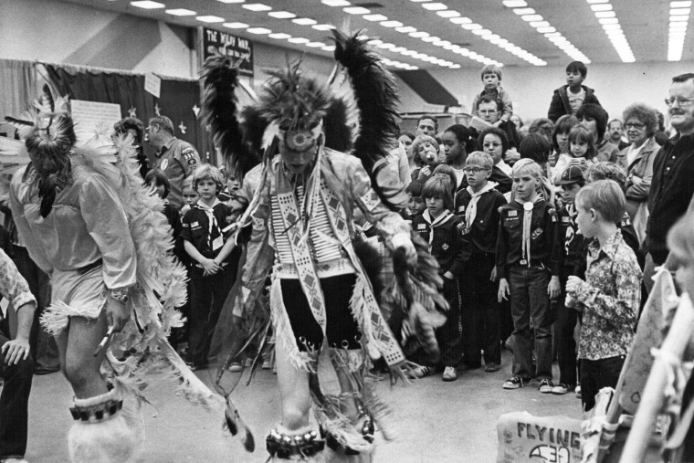 Young Cub Scouts and others watch a dance performance during an annual event by the Denver Area Council of Boy Scouts of America in 1976. 