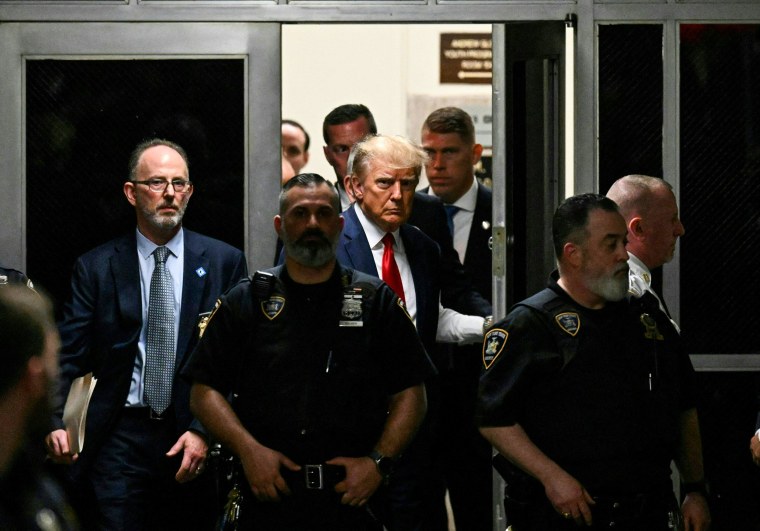 Former President Donald Trump makes his way inside the Manhattan Criminal Courthouse in New York on April 4, 2023.