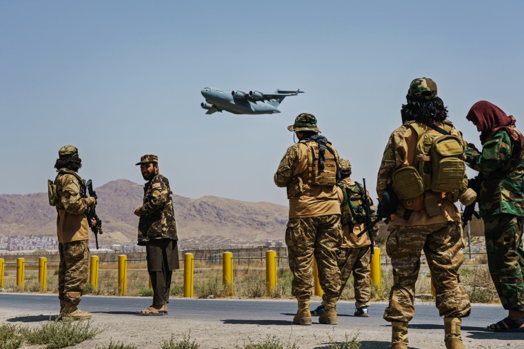 Taliban fighters secure the outer perimeter of the Hamid Karzai International Airport