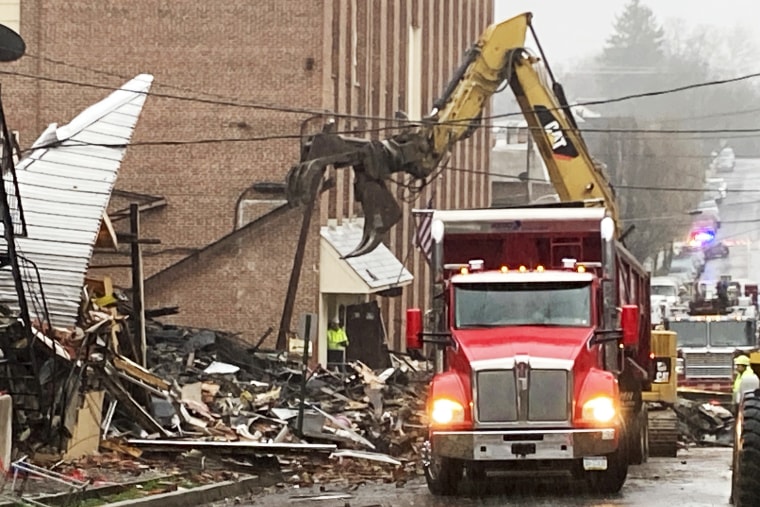 Rubble is cleared at the site of a deadly explosion at a chocolate factory in West Reading, Pa., Saturday, March 25, 2023.