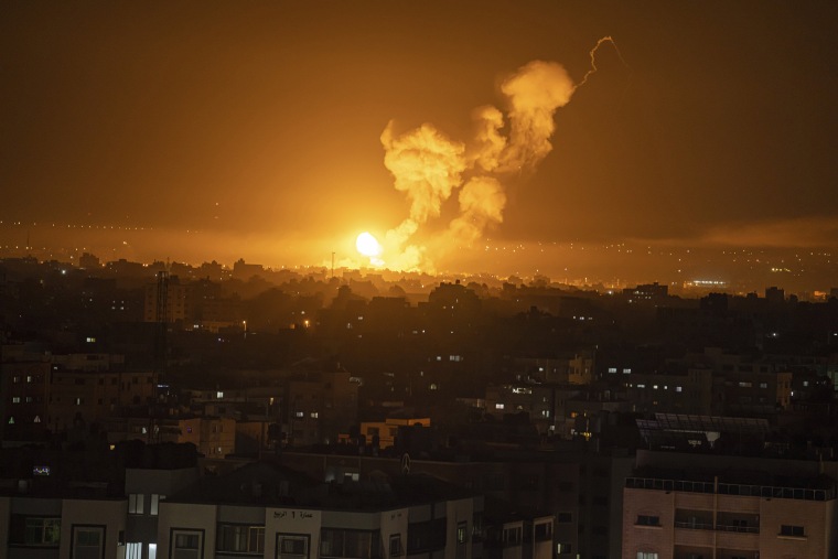 Fire and smoke rise following an Israeli airstrike in central Gaza Strip, on April 7, 2023.