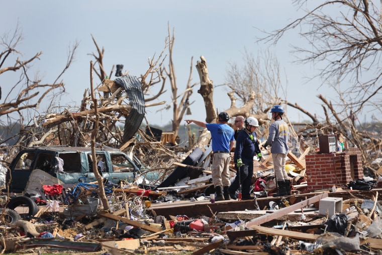 Search and rescue team members continue to look for tornado victims in Rolling Fork, Miss.