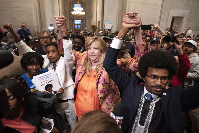 Former Rep. Justin Jones, D-Nashville, Rep. Gloria Johnson, D-Knoxville, and former Rep. Justin Pearson, D-Memphis, raises their hands outside the House chamber after Jones and Pearson were expelled from the legislature Thursday, April 6, 2023, in Nashville, Tenn.