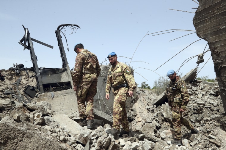 Italian U.N. peacekeeper soldiers inspect a small bridge that was destroyed by an Israeli airstrike, in Maaliya village, Lebanon