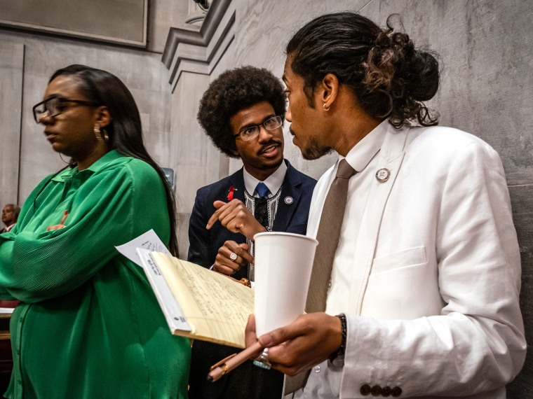 Image: Democratic state Reps. Justin Pearson, center, of Memphis and Justin Jones, right, of Nashville attend the vote in which they were expelled from the state Legislature on April 6, 2023 in Nashville, Tenn.