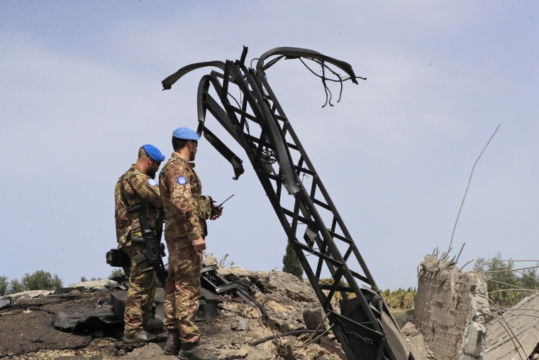 Italian U.N. peacekeeper soldiers inspect a small bridge that was destroyed by an Israeli airstrike in Maaliya village, south Lebanon, Friday, April 7, 2023.