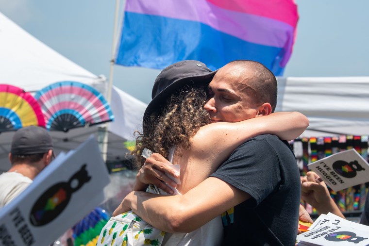 Two people hug during the Williamson County Pride Festival in Franklin, Tenn.