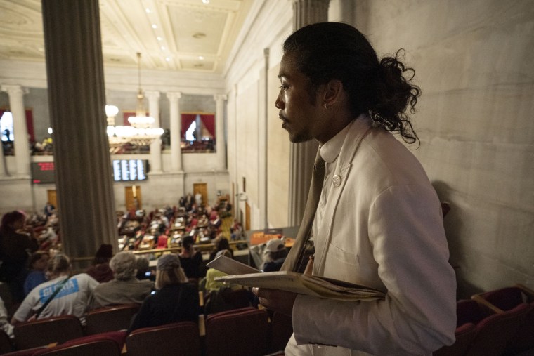 Former Rep. Justin Jones looks for a seat in the gallery of the House chamber after being expelled from the legislature in Nashville, Tenn.