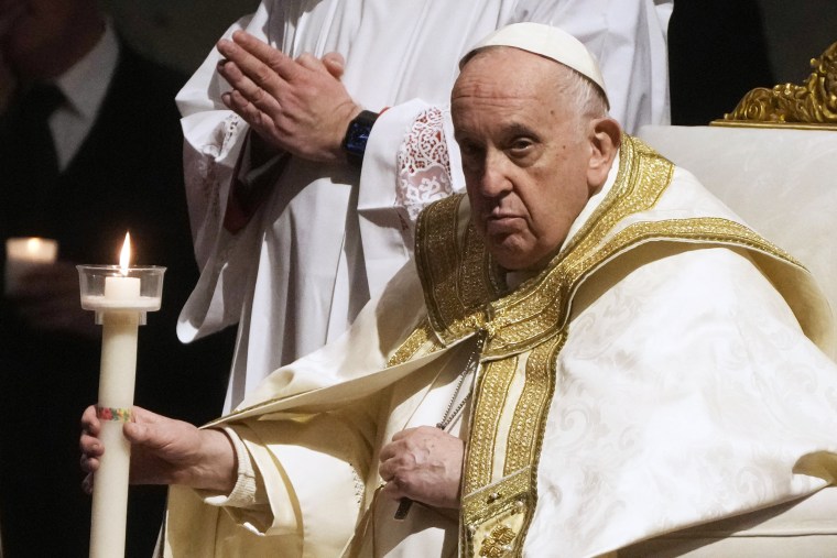 Pope Francis presides over an Easter vigil ceremony in St. Peter's Basilica