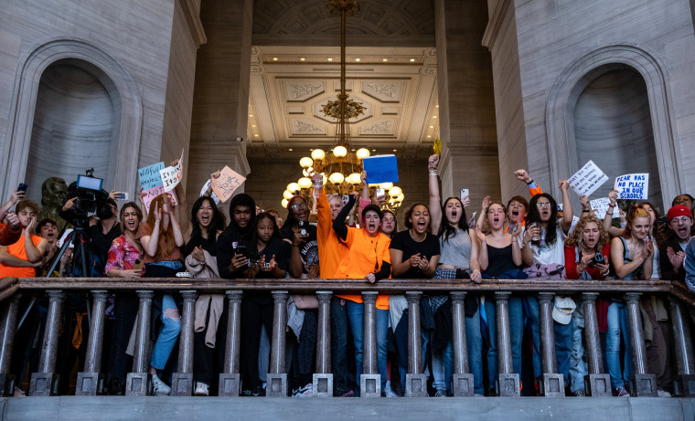 People protest inside the Tennessee State Capitol to call for an end to gun violence and support stronger gun laws