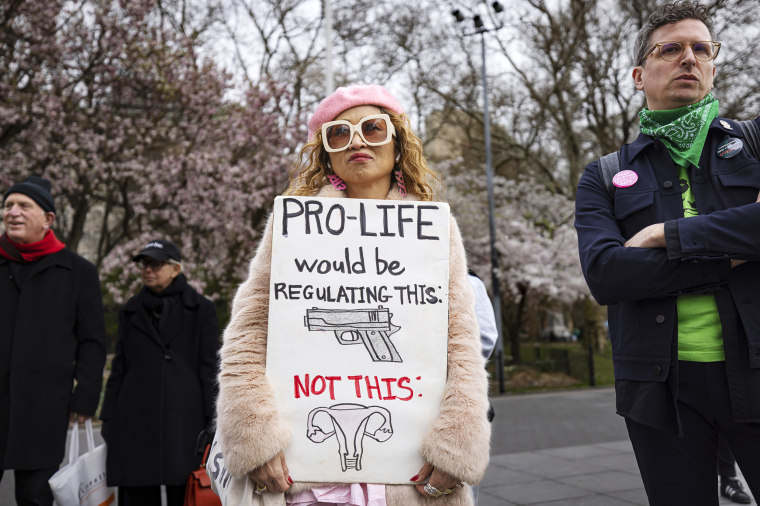 A pro-choice activist holds a sign during a protest in New York City on Saturday.