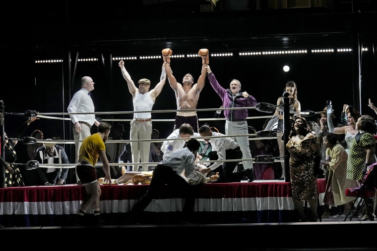 Ryan Speedo Green, center, as Young Emile Griffith, Paul Groves, purple jacket, as Howie Albert, and Latonia Moore, right, as Emelda Griffith in Terence Blanchard's "Champion."