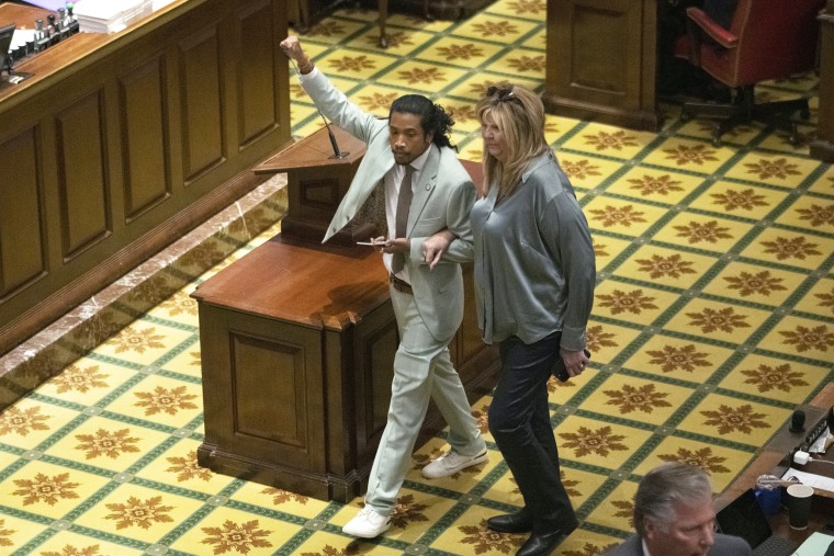 Rep. Justin Jones, D-Nashville, walks into the House chamber with Rep. Gloria Johnson, D-Knoxville, Monday, April 10, 2023, in Nashville, Tenn. Jones was appointed to represent District 52 by the Metro Nashville City Council earlier in the day after being expelled the previous week for using a bullhorn to shout support for pro-gun control protesters in the House chamber. 