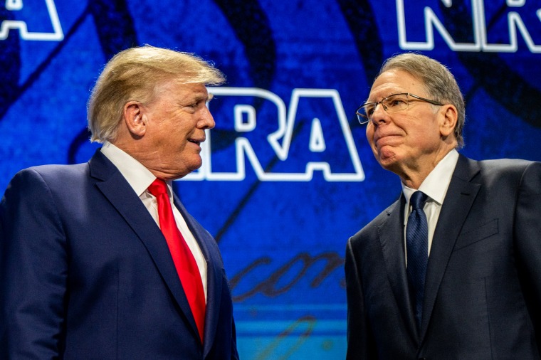 Former President Donald Trump greets NRA CEO Wayne LaPierre at the organization's annual convention on May 27, 2022, in Houston.
