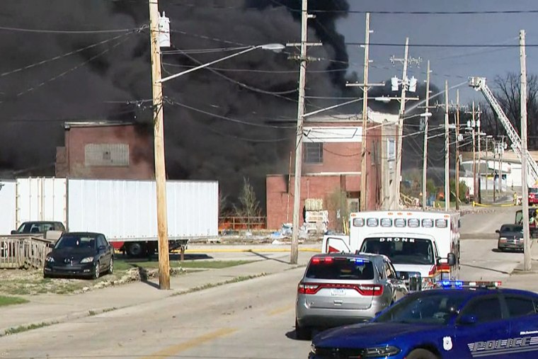 Emergency vehicles near a large fire at a plastics recycling processing facility in Richmond, Ind., on April 11, 2023.
