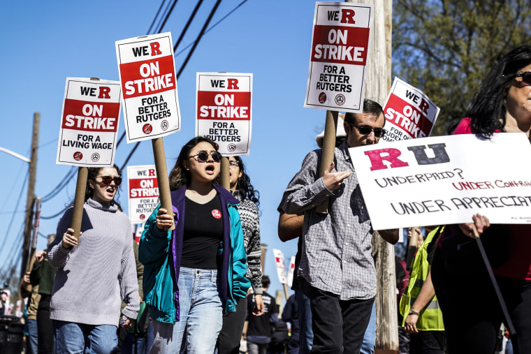 Image: Strikers march in front of Rutgers' buildings in New Brunswick, N.J., on April 10, 2023. 