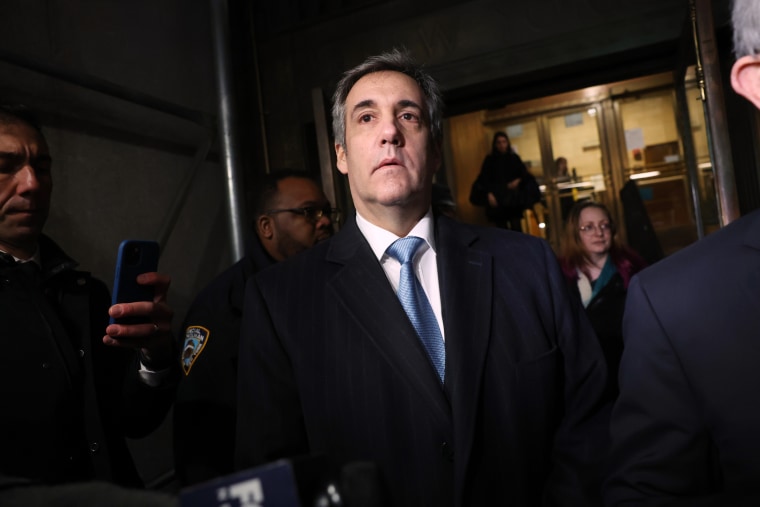 Former Donald Trump lawyer Michael Cohen leaves the courthouse after testifying before a grand jury in New York