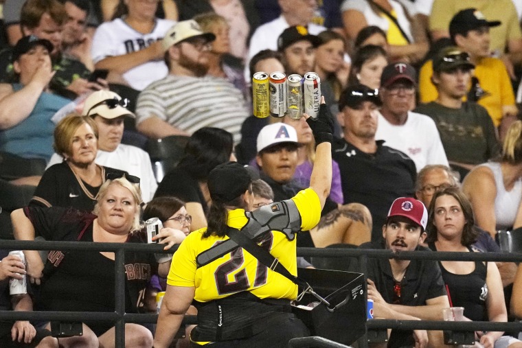 A beer vendor walks through the stands during the seventh inning of a baseball game between the Arizona Diamondbacks and the Milwaukee Brewers on April 11, 2023, in Phoenix.