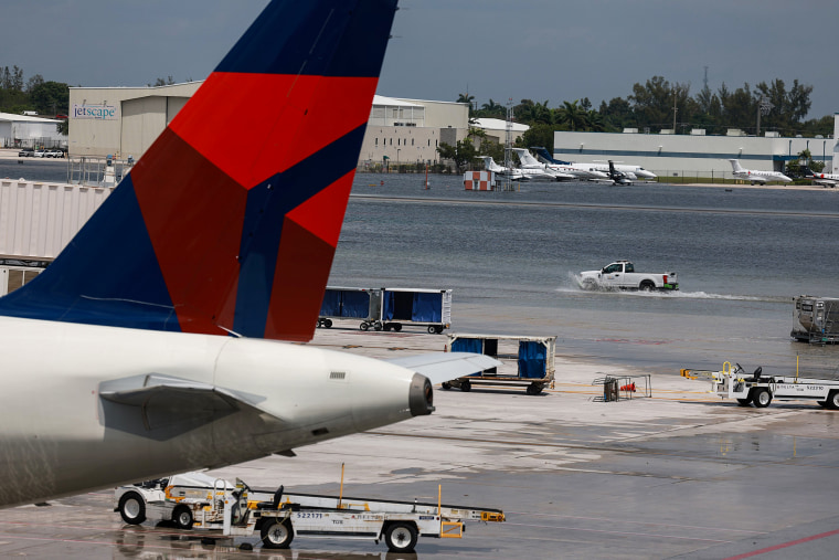 Planes stand at their gates after Fort Lauderdale-Hollywood International Airport was closed due to flooding on April 13, 2023.