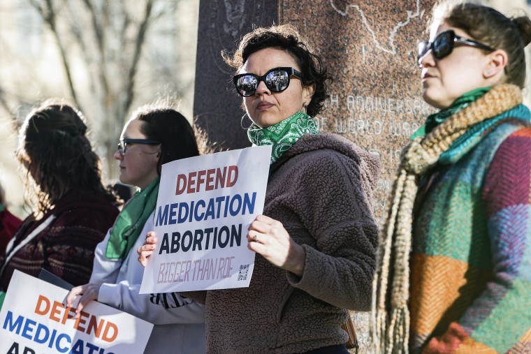 A woman protests in support of access to abortion medication on March 15, 2023 in Amarillo, Texas.