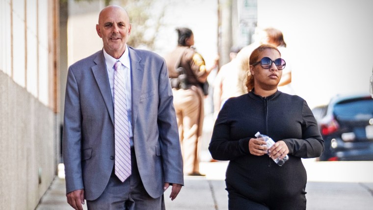 Deja Taylor arrives with attorney James Ellenson at the Sheriff's Office in Newport News, Va., on April 13, 2023, to turn herself in.