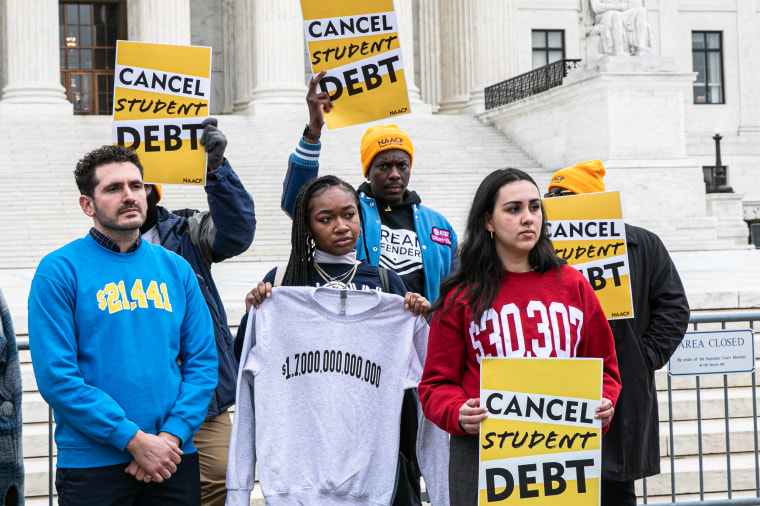 Demonstrators in favor of cancelling student debt rally outside the Supreme Court
