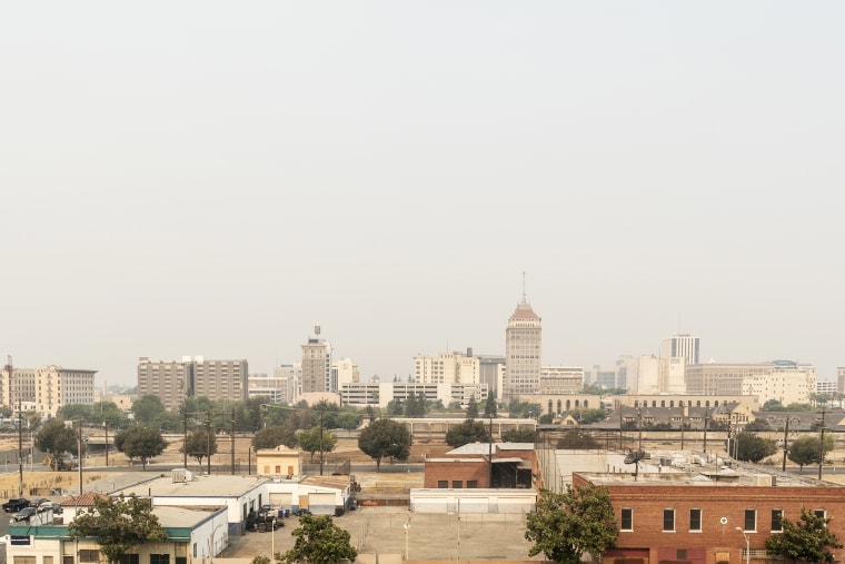 Smoke surrounds downtown Fresno, California, U.S., on Wednesday, Aug. 19, 2020. More than 360 blazes are burning in California, forcing mass evacuations in the northern part of the state and creating an air quality emergency.