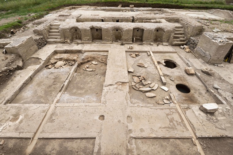 An elevated view of the villa, with a wine cellar in the foreground and treading floor and presses behind. Experts believe the site was used to celebrate the process of winemaking.