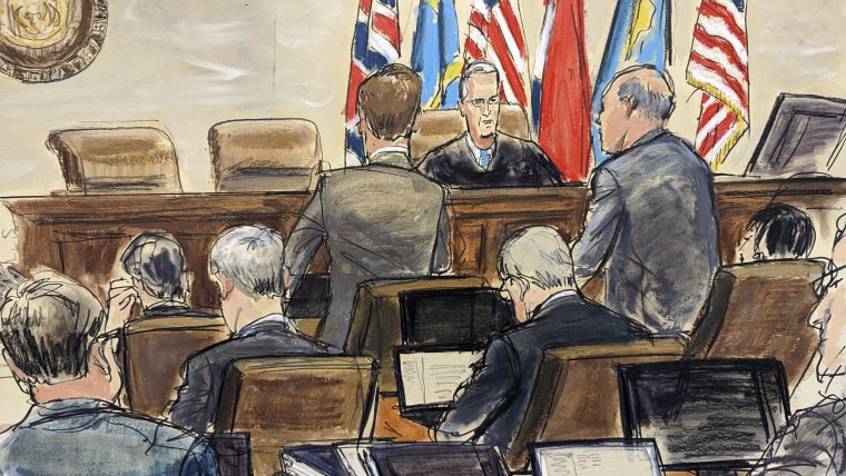 This artist sketch depicts Dominion Voting Systems attorney Justin Nelson, standing left, and Fox News attorney Daniel Webb, standing at right, speaking to Judge Eric Davis before finishing jury selection in Delaware Superior Court on Tuesday in Wilmington, Del. 