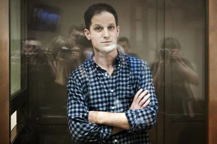 U.S. journalist Evan Gershkovich stands inside a defendants' cage in Moscow on April 18, 2023.