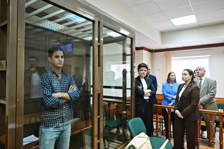 U.S. journalist Evan Gershkovich stands inside a defendants' cage  in Moscow on April 18, 2023. 