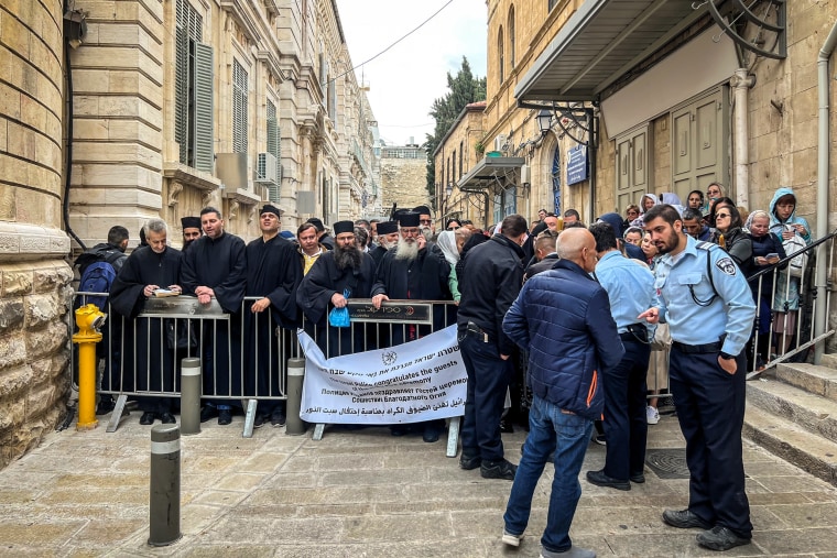 Christian worshippers are kept away from the Church of the Holy Sepulchre by Israel Police in the Christian Quarter of the Old City of Jerusalem on April 15, 2023.