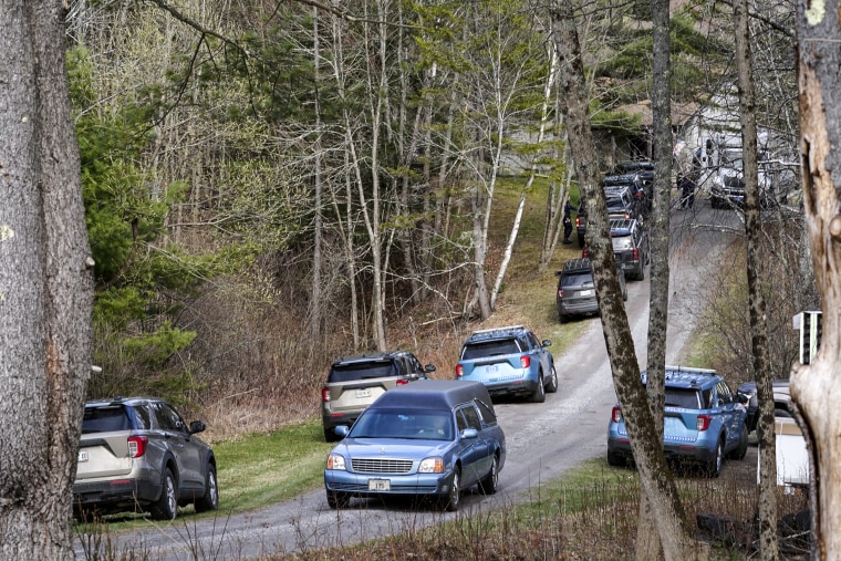 Image: A hearse leaves the scene of a shooting on April 18, 2023, in Bowdoin, Maine. 