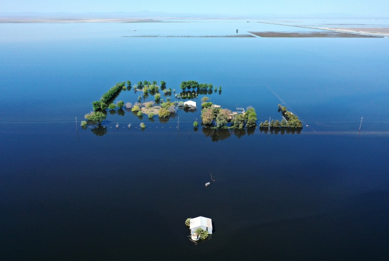 A home surrounded by floodwaters of the reemerging Tulare Lake in on April 14, 2023 in Corcoran in California's Central Valley.