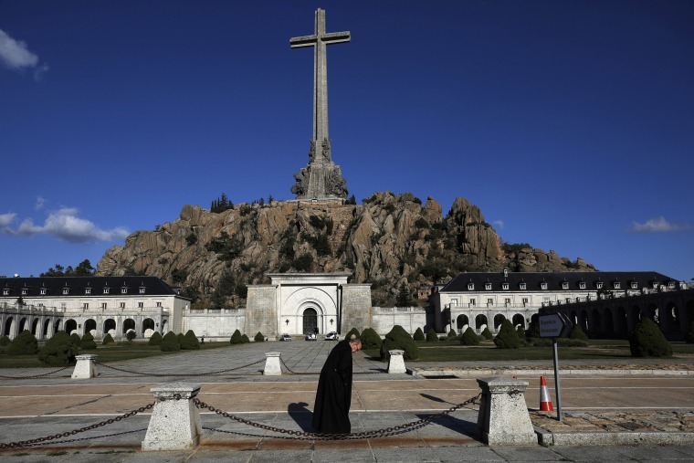 A friar walks in front of the Valley of the Fallen mausoleum in Madrid, Spain.