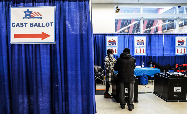 Voters cast their vote as early voting begins on March 20, 2023, for Chicago's runoff election.