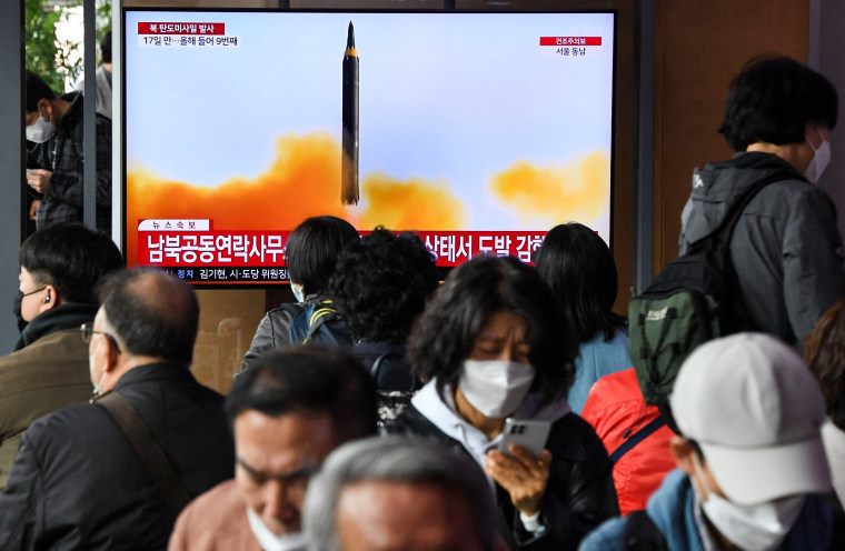 People a news broadcast with file footage of a North Korean missile test at a railway station in Seoul, South Korea, on April 13, 2023.