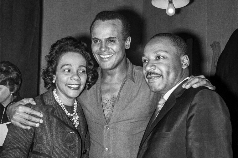 Harry Belafonte with Coretta Scott King and Martin Luther King Jr. during a meeting of the "Movement for the Peace" at the Palais des Sports in Paris on March 28, 1966.
