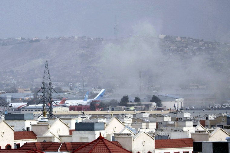 FILE - Smoke rises from a deadly explosion outside the airport in Kabul, Afghanistan, Thursday, Aug. 26, 2021. Two suicide bombers and gunmen have targeted crowds massing near the Kabul airport, in the waning days of a massive airlift that has drawn thousands of people seeking to flee the Taliban takeover of Afghanistan. The Taliban have killed the senior Islamic State group leader behind the August 2021 bombing outside the Kabul airport that killed 13 service members and about 170 Afghans. That is according to the father of a Marine killed in the attack who was briefed on April 25, 2023, by military officials.