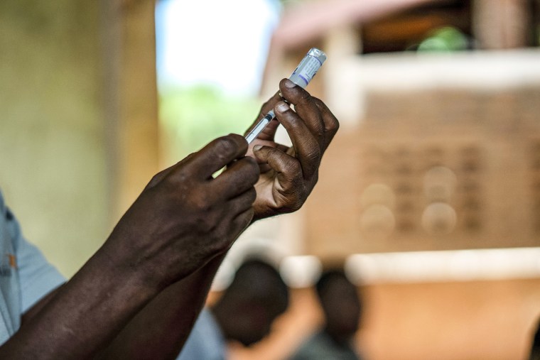 Image: Health officials prepare to administer a vaccine in the Malawi village of Tomali with the world's first vaccine against malaria in a pilot program on Dec. 11, 2019.